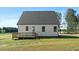 Backyard with a wooden deck overlooking a lush green lawn at 1467 Antioch Church Rd, Timberlake, NC 27583