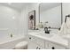 Bright bathroom featuring a white vanity, modern fixtures, and a shower-tub combination at 1467 Antioch Church Rd, Timberlake, NC 27583