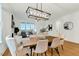 Open dining room features natural light from surrounding windows and transitions to living room at 1467 Antioch Church Rd, Timberlake, NC 27583