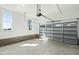 Clean garage with natural light, concrete floor, and an insulated garage door at 1467 Antioch Church Rd, Timberlake, NC 27583
