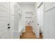 Hallway featuring built-in shelves and a bench, leading to the laundry and bathroom areas at 1467 Antioch Church Rd, Timberlake, NC 27583