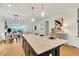 Spacious kitchen with island, countertops with decor, and open transition to dining and living area at 1467 Antioch Church Rd, Timberlake, NC 27583