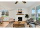 Bright living room features a fireplace and large windows at 1467 Antioch Church Rd, Timberlake, NC 27583