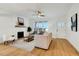 Bright living room with fireplace, lots of natural light, and hardwood floors at 1467 Antioch Church Rd, Timberlake, NC 27583