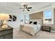 Well-lit main bedroom features a tray ceiling, large windows, and elegant decor at 1467 Antioch Church Rd, Timberlake, NC 27583