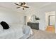 Spacious main bedroom features a tray ceiling, bright windows, and neutral decor at 1467 Antioch Church Rd, Timberlake, NC 27583