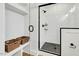 Modern bathroom showcasing a glass-enclosed shower and built-in shelving next to a closet at 1467 Antioch Church Rd, Timberlake, NC 27583