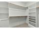 Spacious walk-in closet with built-in shelving and hanging rods for optimal storage at 1467 Antioch Church Rd, Timberlake, NC 27583
