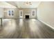 Spacious living room with hardwood floors, fireplace, and lots of natural light at 182 Inverness St, Zebulon, NC 27597