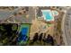 Aerial shot of tennis court, pool and playground with parking and clubhouse at 1922 Pattersons Mill Rd, Durham, NC 27703