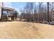Large backyard with a small deck and wooded views at 1922 Pattersons Mill Rd, Durham, NC 27703