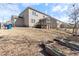 Large backyard with grass, raised garden beds, and a wooded area at 1922 Pattersons Mill Rd, Durham, NC 27703