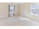 Bedroom with two windows and neutral carpet at 1922 Pattersons Mill Rd, Durham, NC 27703
