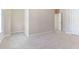 Bedroom with neutral carpet, white door, and trim at 1922 Pattersons Mill Rd, Durham, NC 27703