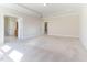 Large bedroom with neutral carpet and view of ensuite bathroom at 1922 Pattersons Mill Rd, Durham, NC 27703