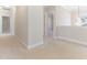 Spacious hallway with neutral carpet, white walls, and crown molding at 1922 Pattersons Mill Rd, Durham, NC 27703