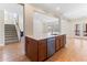 Modern kitchen island with stainless steel dishwasher and hardwood floors at 1922 Pattersons Mill Rd, Durham, NC 27703