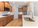 Modern kitchen featuring quartz countertops, stainless steel appliances, and ample cabinet space at 1922 Pattersons Mill Rd, Durham, NC 27703