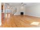 Open concept living room with hardwood floors, fireplace, and lots of natural light at 1922 Pattersons Mill Rd, Durham, NC 27703