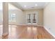 Spacious living room with hardwood floors and a double door leading to the exterior at 1922 Pattersons Mill Rd, Durham, NC 27703