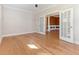 Bright office space with hardwood floors and French doors, offering a flexible and stylish work area at 1922 Pattersons Mill Rd, Durham, NC 27703
