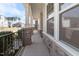 Covered porch with stone pillars and detailed railings, offering a welcoming outdoor space with neighborhood views at 1922 Pattersons Mill Rd, Durham, NC 27703