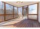 Enclosed screened porch offers an inviting view of the surrounding trees at 1922 Pattersons Mill Rd, Durham, NC 27703