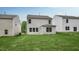 View of the home's backyard and lawn with neighboring houses, showcasing outdoor space at 194 Oak Barrel Rd, Smithfield, NC 27577