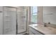 The bathroom offers a stand up shower and a single sink vanity with quartz countertops at 194 Oak Barrel Rd, Smithfield, NC 27577