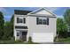 Two-story home with gray siding, black shutters, attached two-car garage, and partial stone veneer at 194 Oak Barrel Rd, Smithfield, NC 27577