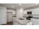 Modern kitchen featuring white cabinets, stainless steel appliances, and a granite countertop island at 194 Oak Barrel Rd, Smithfield, NC 27577