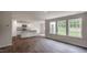 Open-concept living area featuring an island kitchen, recessed lights, and wood-look floors at 194 Oak Barrel Rd, Smithfield, NC 27577