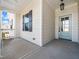Inviting covered front porch features decorative pillars, light fixture, and light blue front door at 20 Wildflower Ln, Franklinton, NC 27525