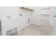 Clean, well-lit laundry room with white utility sink and washer and dryer hookups at 20 Wildflower Ln, Franklinton, NC 27525