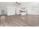 Bright, open-concept living space with hardwood floors, fireplace, and views into the kitchen at 20 Wildflower Ln, Franklinton, NC 27525