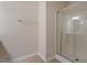 Bathroom featuring a tiled floor and a glass enclosed shower stall at 2017 Ollivander Dr, Cary, NC 27519