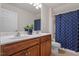 A charming bathroom with a double sink vanity and nautical-themed shower curtain at 2017 Ollivander Dr, Cary, NC 27519