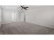Spacious carpeted bedroom offering neutral color scheme with multiple doorways at 2017 Ollivander Dr, Cary, NC 27519