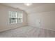 Carpeted bedroom featuring one window with blind, and an access door at 2017 Ollivander Dr, Cary, NC 27519