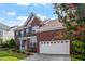 Brick two-story home featuring a manicured lawn and two-car garage at 2017 Ollivander Dr, Cary, NC 27519
