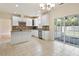 Bright eat-in kitchen with granite countertops, tile flooring, and stainless steel appliances at 2017 Ollivander Dr, Cary, NC 27519