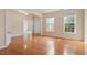 Open floor plan with hardwood floors, view to entry and side window provide natural light at 2017 Ollivander Dr, Cary, NC 27519