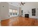 Bright living room featuring tall ceilings, large windows, fireplace and hardwood floors for a comfortable space at 2017 Ollivander Dr, Cary, NC 27519