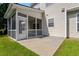 Outdoor patio area next to a screened porch and lawn at 2017 Ollivander Dr, Cary, NC 27519