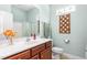 Bright bathroom with a marble countertop, modern fixtures, and a clean, fresh design at 208 Abigail Ln, Gibsonville, NC 27249