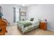 Comfortable bedroom with neutral tones, a cozy bed, and ample natural light at 208 Abigail Ln, Gibsonville, NC 27249