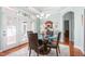 Dining room with a glass table and doors that open to the patio at 208 Abigail Ln, Gibsonville, NC 27249