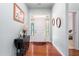 Inviting foyer with hardwood floors, decorative accents, and a view into the home at 208 Abigail Ln, Gibsonville, NC 27249