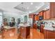Spacious kitchen with a central island, stainless steel appliances, and granite countertops at 208 Abigail Ln, Gibsonville, NC 27249
