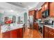 Cherry cabinets kitchen featuring stainless steel appliances and granite counters at 208 Abigail Ln, Gibsonville, NC 27249